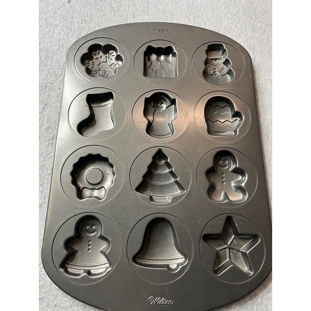Wilton 12 Cup Christmas Holiday Baking Pan Gingerbread Snowman Tree Bell Star